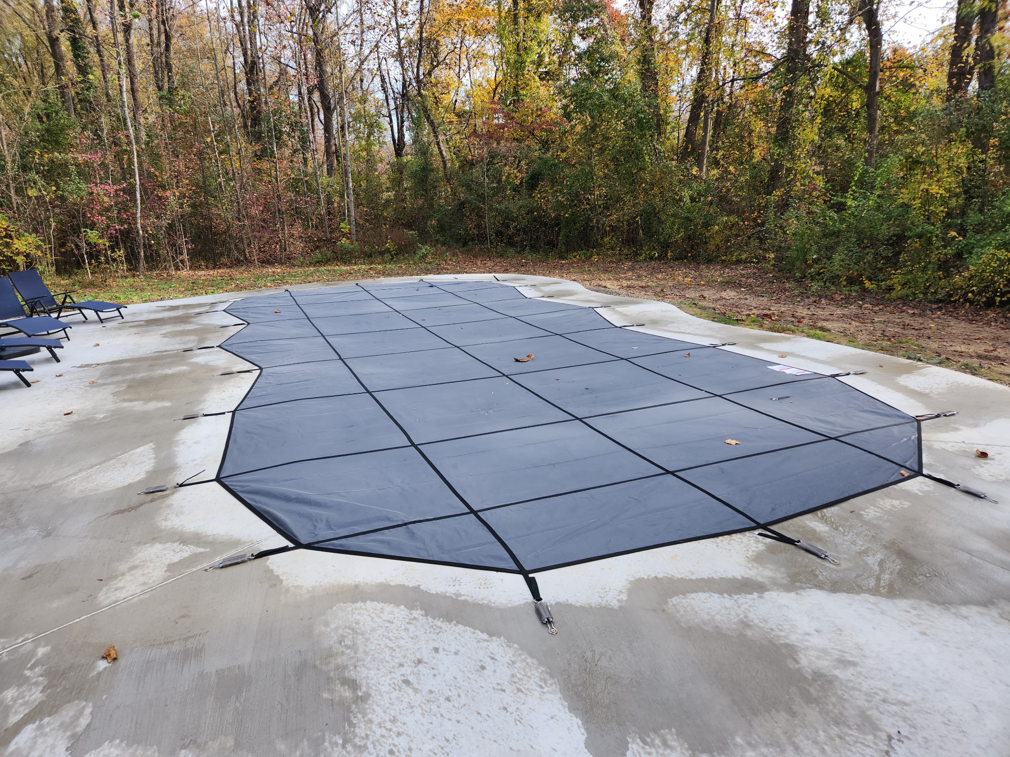 Winter cover protecting pool during off-season